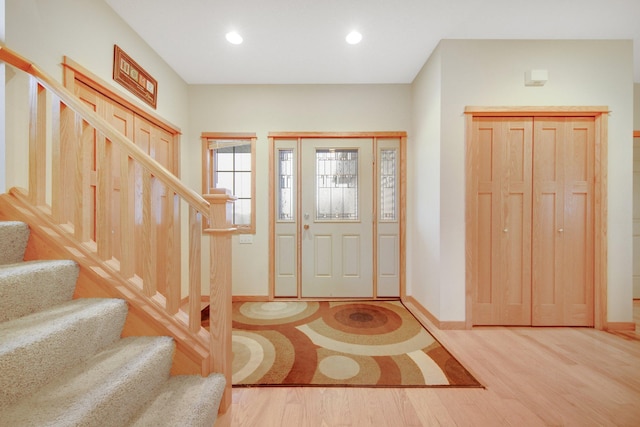 entryway with hardwood / wood-style floors