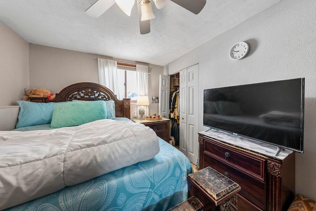 bedroom with a textured ceiling, a closet, and ceiling fan