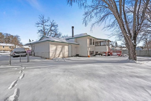 view of snow covered house