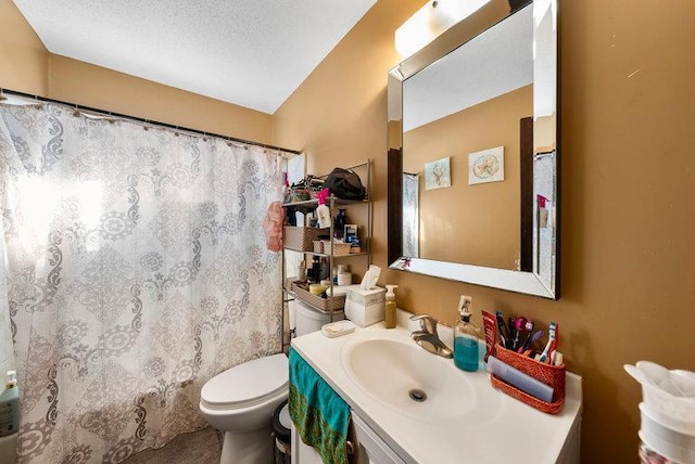 bathroom featuring vanity, a textured ceiling, toilet, and a shower with shower curtain