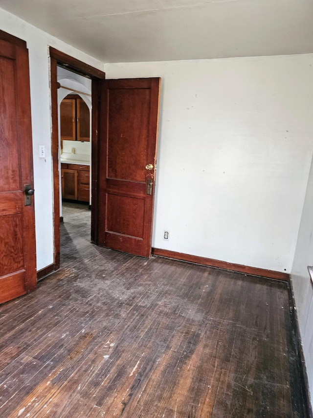 empty room featuring dark hardwood / wood-style floors