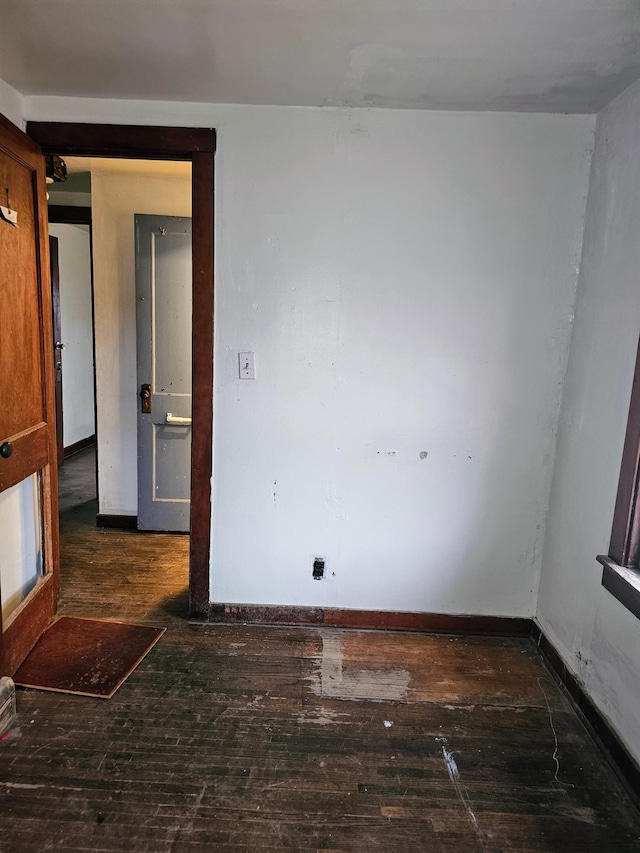 spare room featuring dark hardwood / wood-style flooring