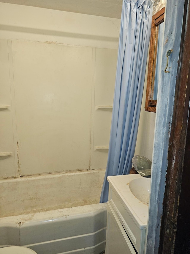 bathroom with vanity and shower / tub combo