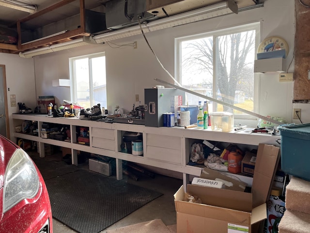 miscellaneous room with concrete floors and a healthy amount of sunlight