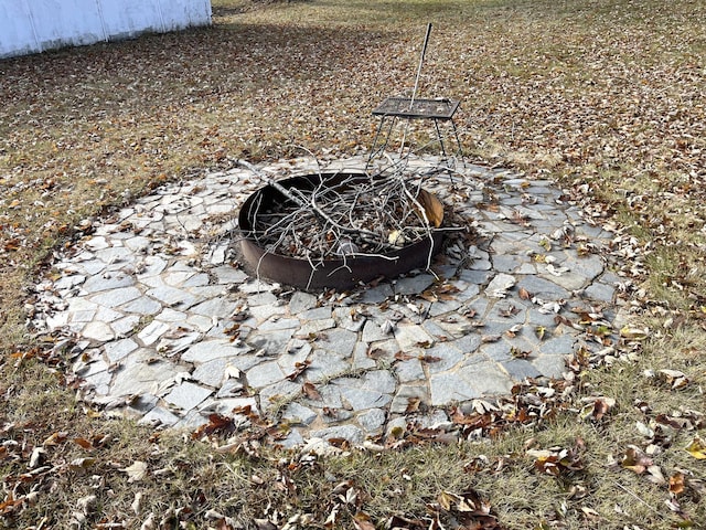 exterior details with an outdoor fire pit