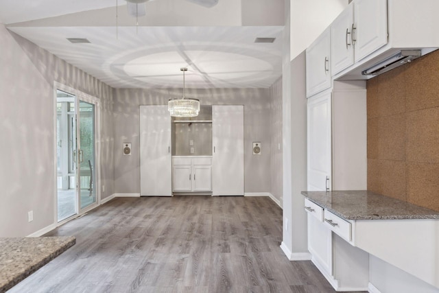 unfurnished dining area with light hardwood / wood-style flooring