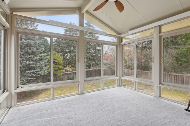 unfurnished sunroom with vaulted ceiling with beams and ceiling fan