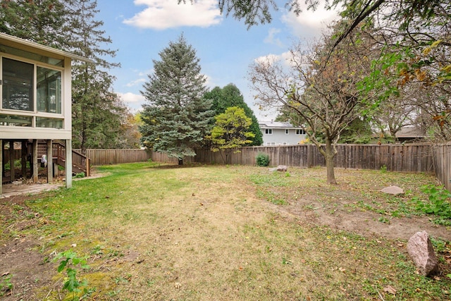 view of yard featuring a sunroom