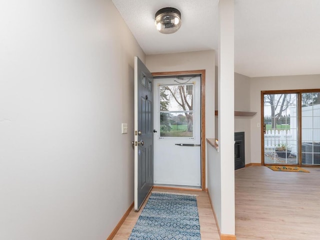 entryway with light hardwood / wood-style floors