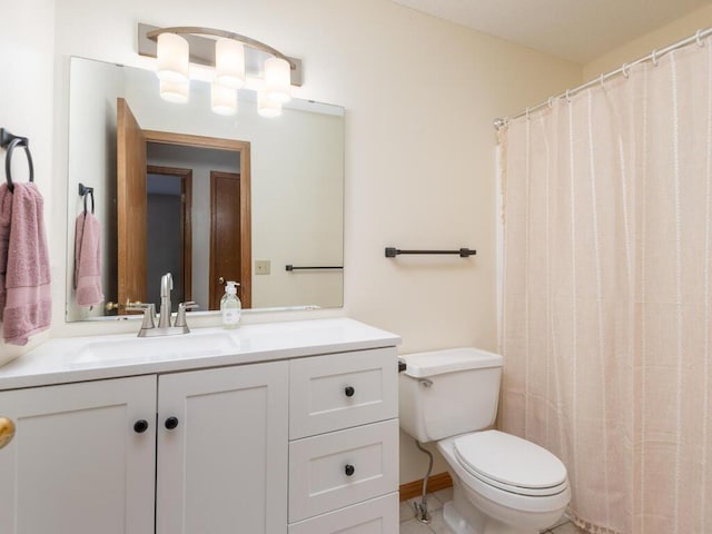 bathroom with toilet and vanity