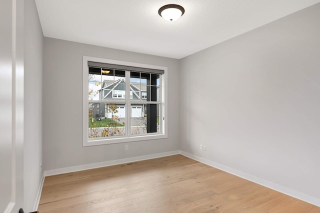 empty room with light wood-type flooring