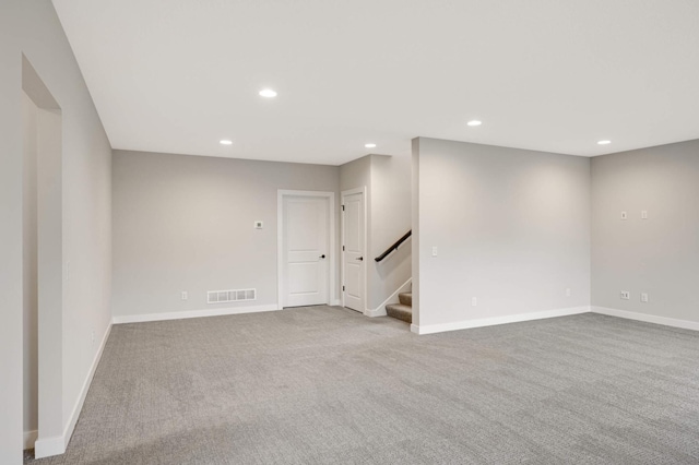 unfurnished room with light colored carpet