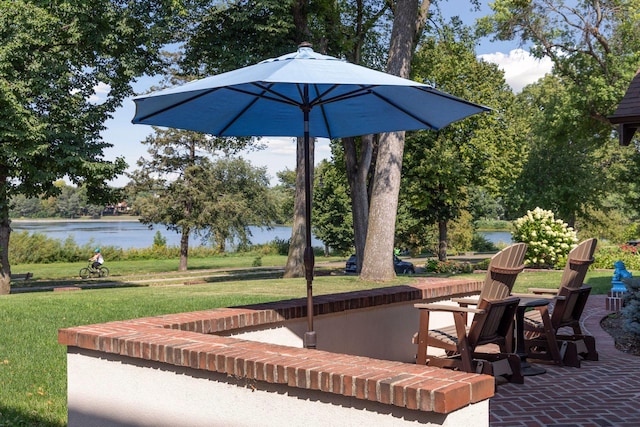 view of patio with a water view