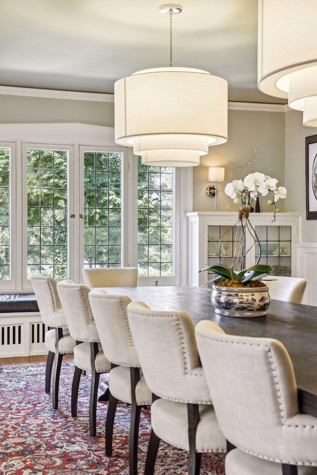 dining space featuring ornamental molding