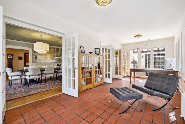 interior space featuring french doors, radiator heating unit, and wood-type flooring