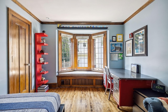 bedroom featuring radiator, crown molding, and light hardwood / wood-style floors