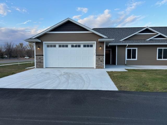 view of front of house with a front lawn and a garage