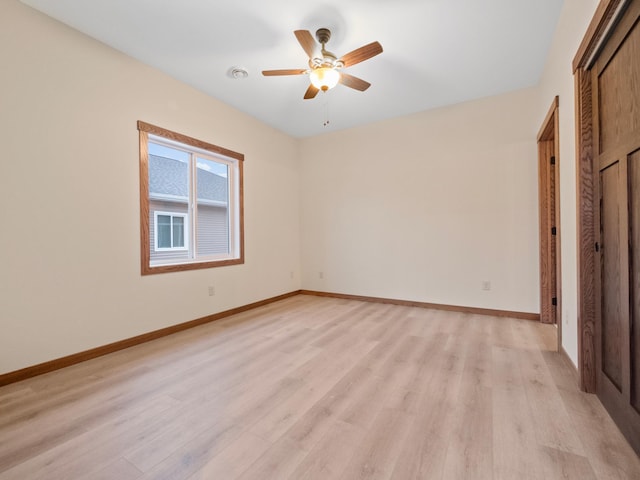 empty room featuring light hardwood / wood-style floors and ceiling fan