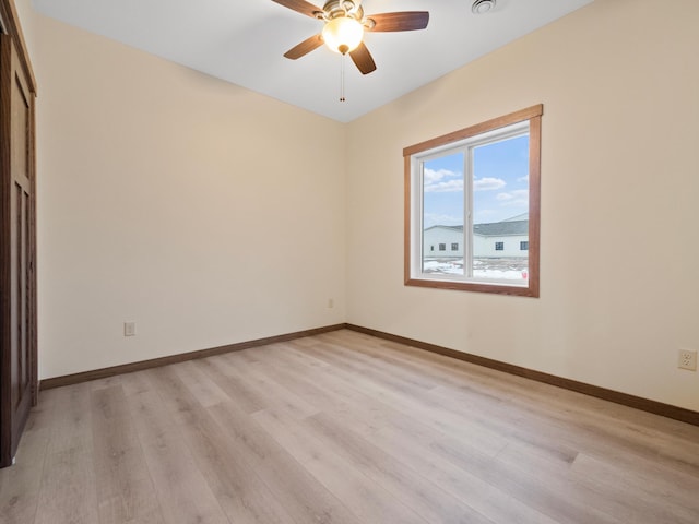 spare room with ceiling fan and light hardwood / wood-style flooring