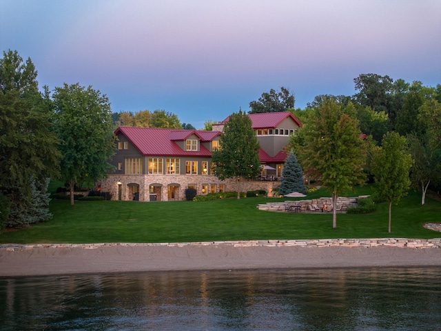 19752 Halwood Rd, Glenwood Twp, MN 56334 - rear view of property with a water view, a lawn, stone siding, and metal roof