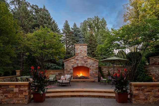 19752 Halwood Rd, Glenwood Twp, MN 56334 - view of patio / terrace with an outdoor stone fireplace