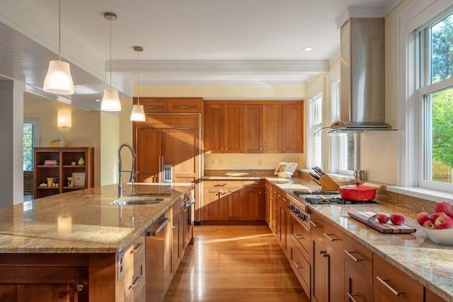19752 Halwood Rd, Glenwood Twp, MN 56334 - kitchen featuring wall chimney exhaust hood, light wood-style floors, a sink, brown cabinetry, and crown molding