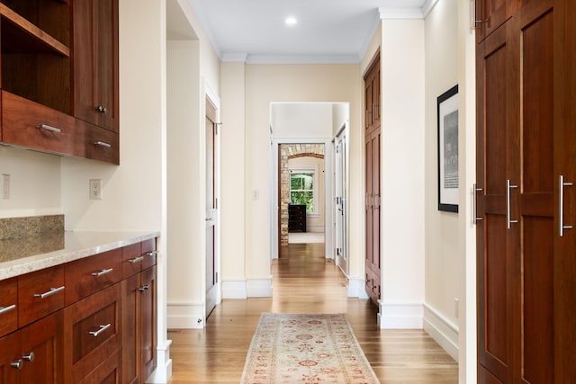 19752 Halwood Rd, Glenwood Twp, MN 56334 - corridor with light wood-type flooring, baseboards, crown molding, arched walkways, and recessed lighting