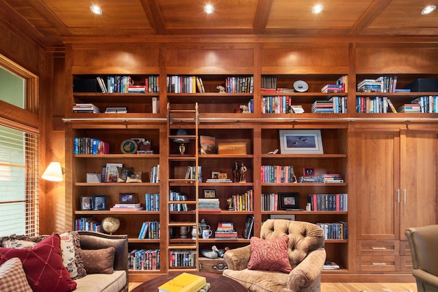 19752 Halwood Rd, Glenwood Twp, MN 56334 - living area with wooden ceiling with exposed beams, bookshelves, recessed lighting, wood walls, and wood finished floors