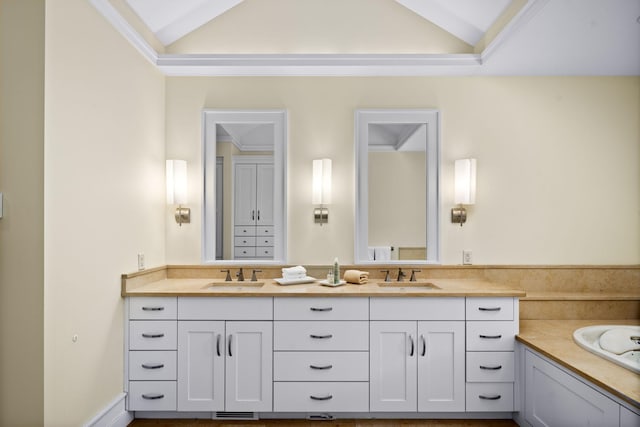 19752 Halwood Rd, Glenwood Twp, MN 56334 - full bathroom with vaulted ceiling, double vanity, and a bathtub