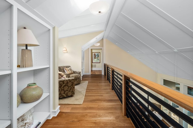19752 Halwood Rd, Glenwood Twp, MN 56334 - hallway featuring lofted ceiling and wood finished floors