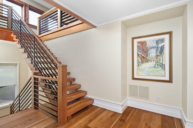 19752 Halwood Rd, Glenwood Twp, MN 56334 - staircase featuring wood finished floors and baseboards