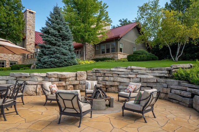 19752 Halwood Rd, Glenwood Twp, MN 56334 - view of patio / terrace with an outdoor fire pit