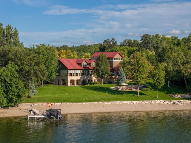 19752 Halwood Rd, Glenwood Twp, MN 56334 - back of property featuring a water view, stone siding, a yard, and metal roof