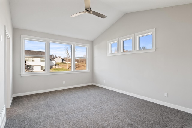 spare room featuring carpet, ceiling fan, and lofted ceiling