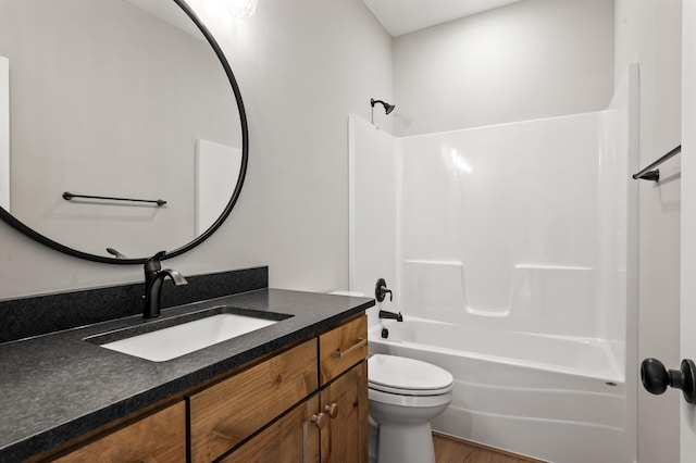 full bathroom featuring wood-type flooring, vanity, toilet, and shower / washtub combination