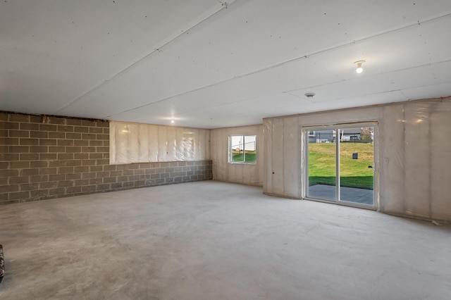 unfurnished room with concrete floors