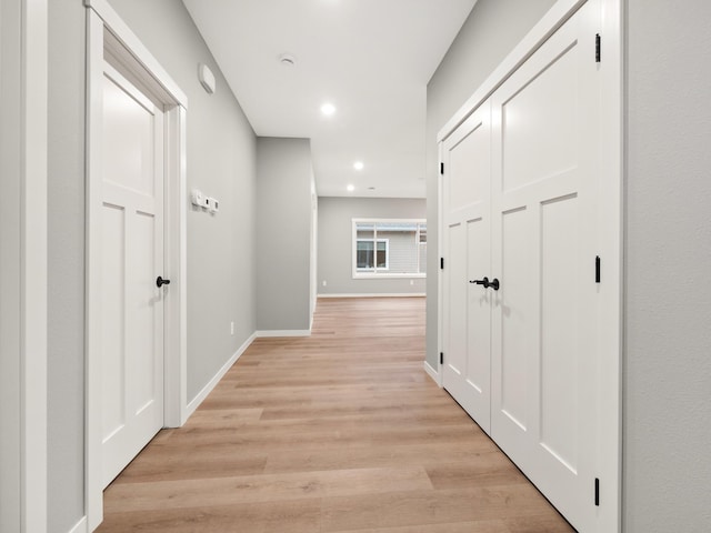 hallway with light wood-type flooring