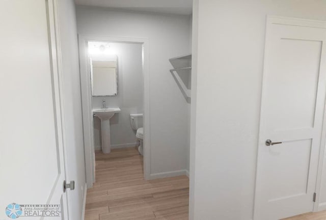 hallway with light wood-type flooring