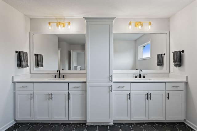 bathroom featuring vanity and a textured ceiling