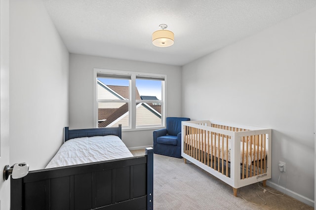 carpeted bedroom with a textured ceiling