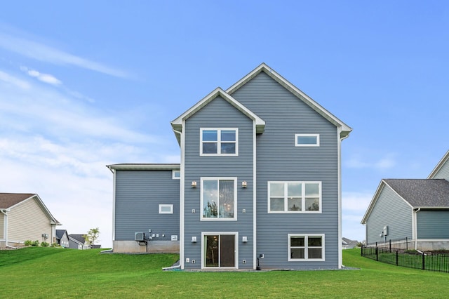 rear view of house with a lawn