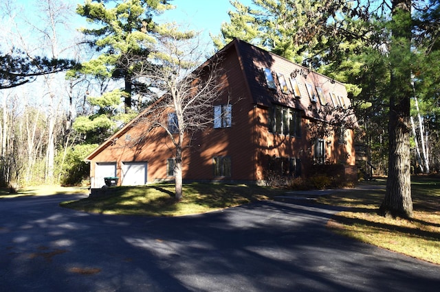 2935 Acorn Ln NE, Bemidji, MN 56601 - view of side of property with driveway and a garage