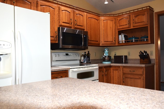 2935 Acorn Ln NE, Bemidji, MN 56601 - kitchen with white appliances, brown cabinets, and light countertops