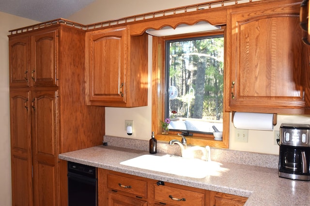 2935 Acorn Ln NE, Bemidji, MN 56601 - kitchen with a sink, light countertops, and brown cabinets