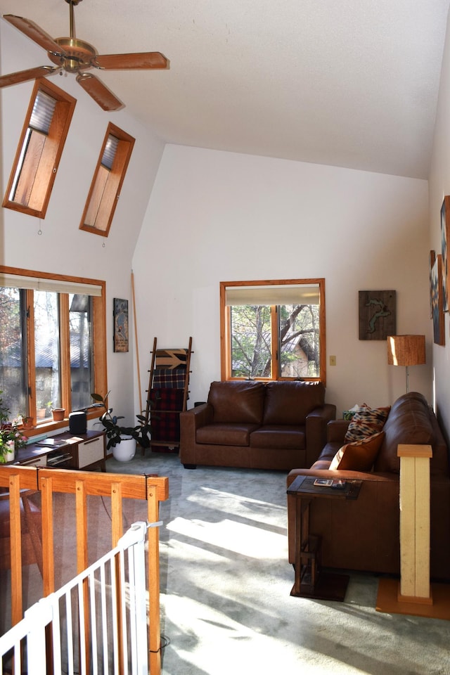 2935 Acorn Ln NE, Bemidji, MN 56601 - living area with carpet floors, a ceiling fan, and high vaulted ceiling