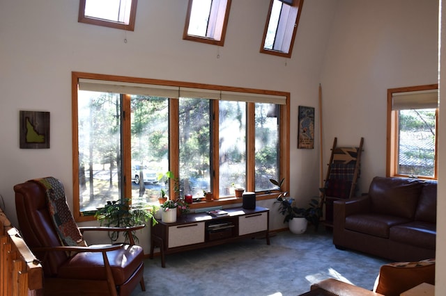 living room with light colored carpet and a high ceiling