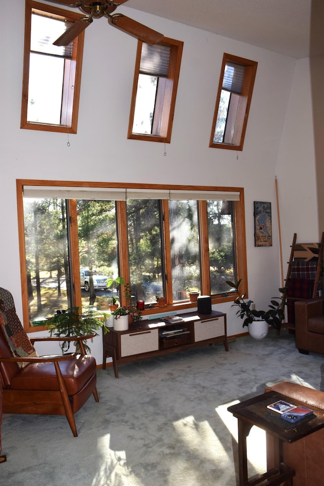2935 Acorn Ln NE, Bemidji, MN 56601 - living room featuring carpet, high vaulted ceiling, and ceiling fan