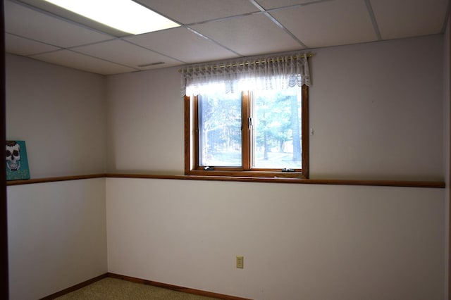 2935 Acorn Ln NE, Bemidji, MN 56601 - empty room with a paneled ceiling, carpet flooring, and baseboards