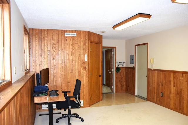 2935 Acorn Ln NE, Bemidji, MN 56601 - office area with wooden walls, a wainscoted wall, electric panel, and a textured ceiling