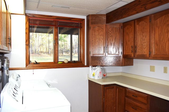 2935 Acorn Ln NE, Bemidji, MN 56601 - laundry room featuring separate washer and dryer and cabinet space